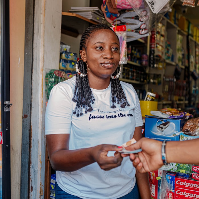 Achieng, running her own small shop